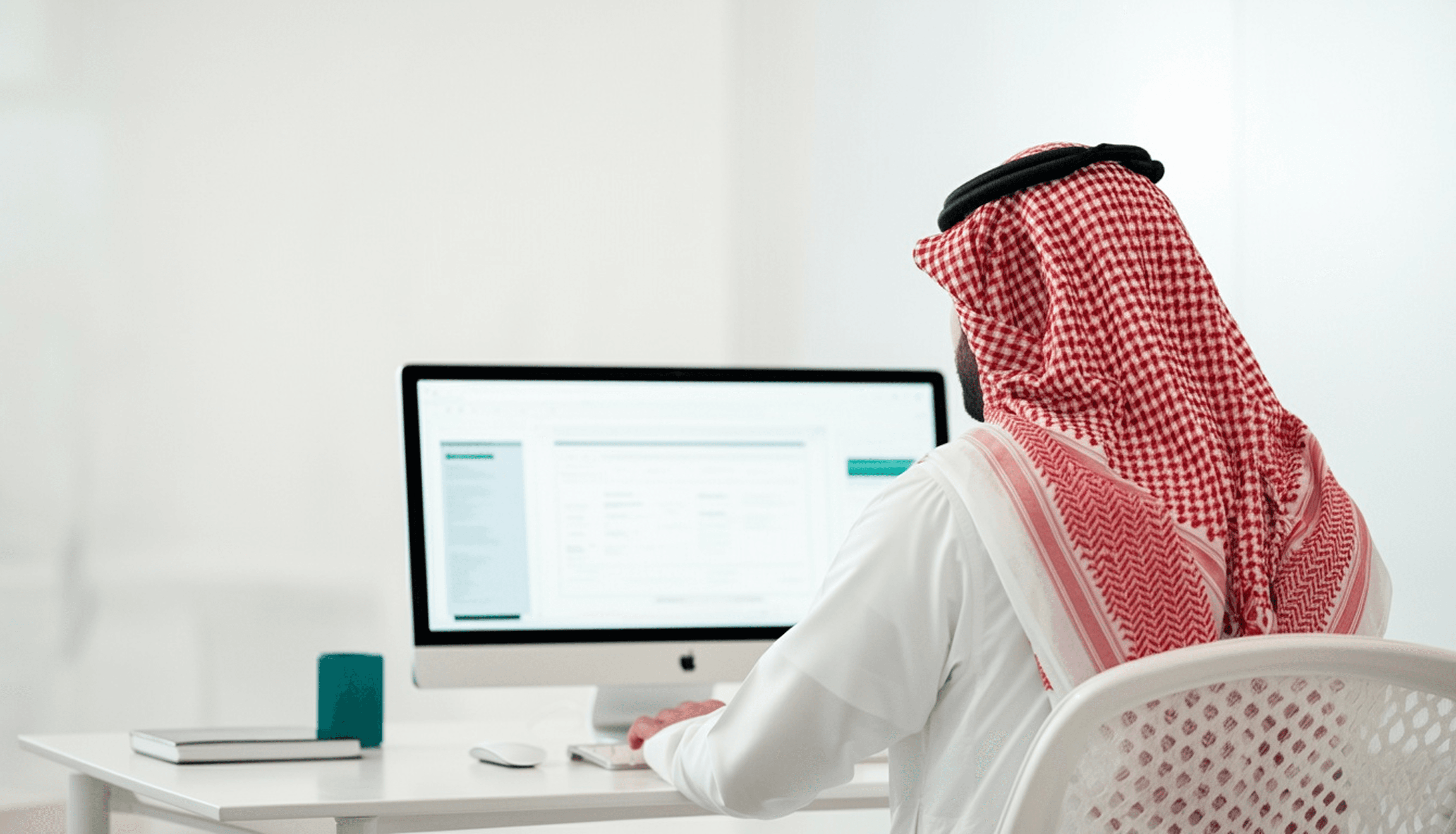 Man Sitting at Desk